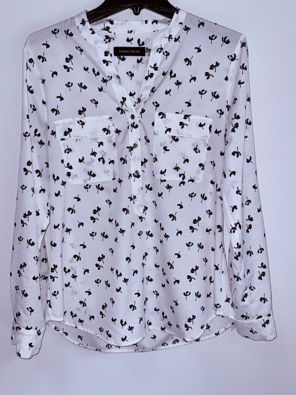 White Blouse with black floral print, v-neck and gold tone buttons